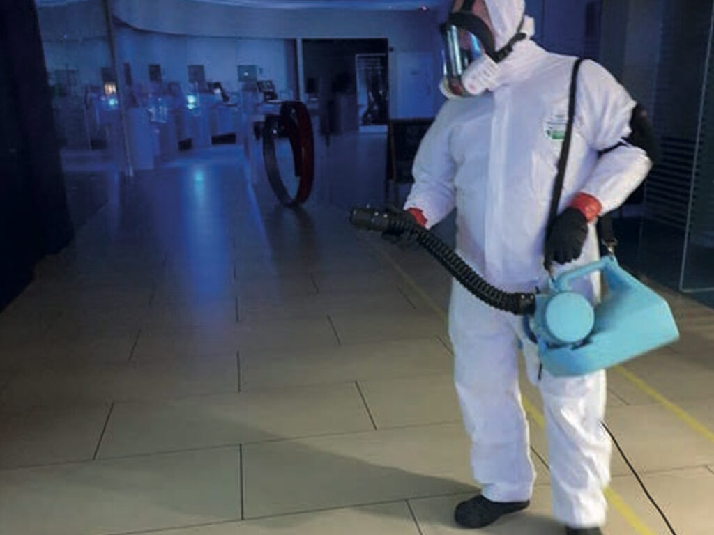covid-19-5 Specialist cleaning soft surfaces contaminated with human waste using professional equipment