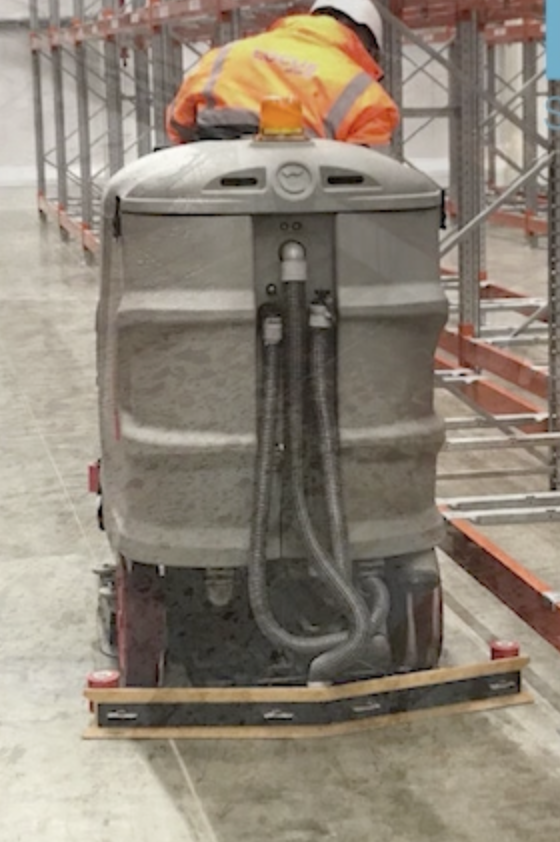 Screenshot 2025-08-04 at 10.03.39 Specialist handling industrial cleaning equipment used in oil spill removal tasks